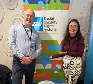 Graeme and Eloise in front of the SSRV stand at the FCVic Conference
