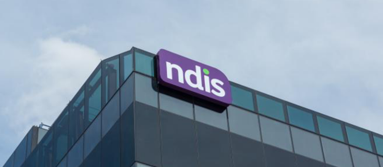 A photo of a building with the NDIS logo attached