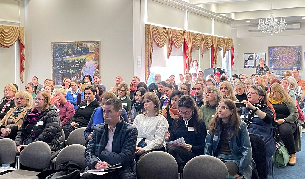 A photograph looking back into the full audience of Festival attendee