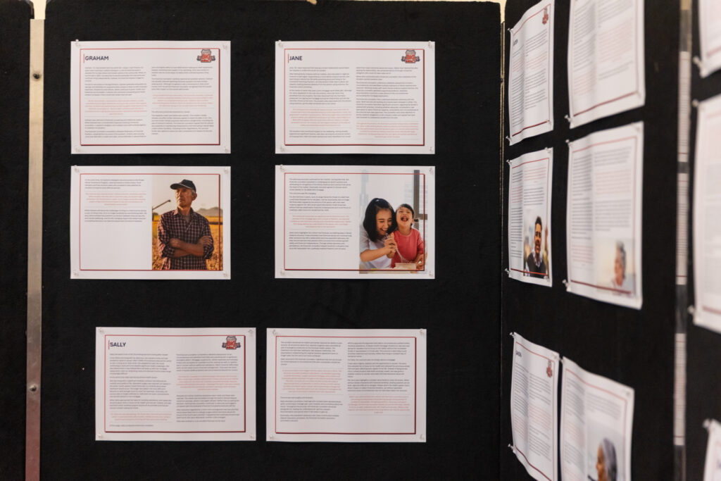 Case study display boards from the Small Sector, Big Impact showcase, featuring client stories with photos and personal accounts of the impact of financial counselling.
