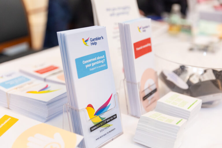Close-up of Gambler's Help brochures on an exhibition table.