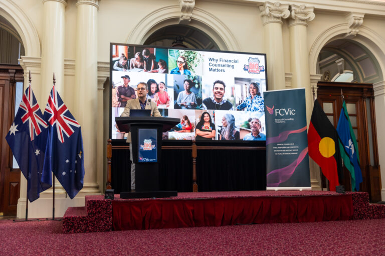 FCVic CEO Zyl Hovenga-Wauchope speaks in front of a slide titled "Why Financial Counselling Matters."