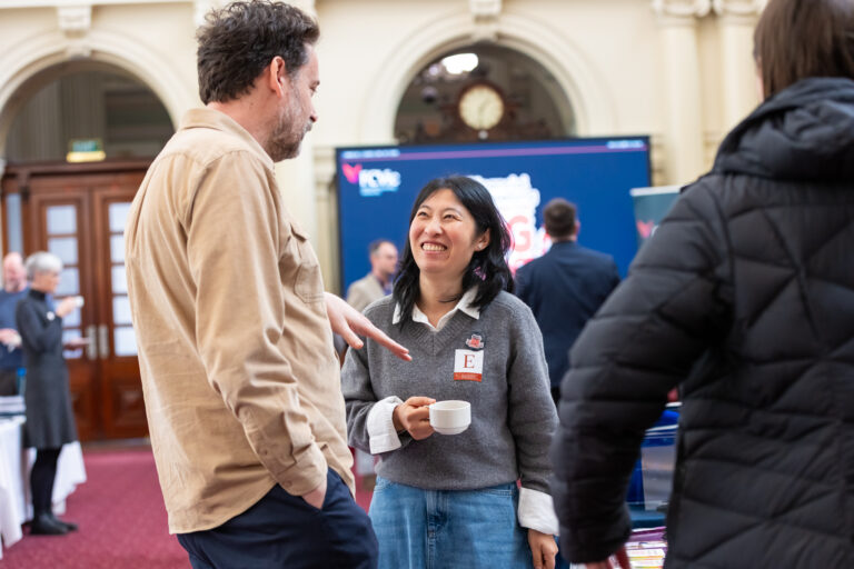 Two financial counsellors near the exhibition screen.