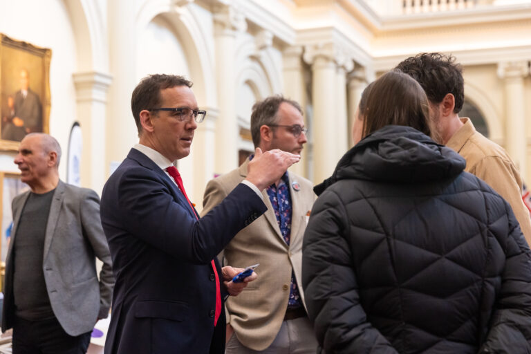 The Hon. Steve Dimopoulos in conversation with showcase attendees.