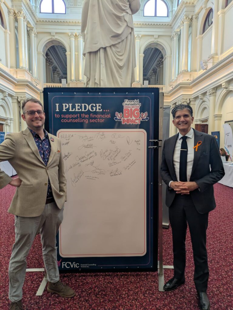 Gary Maas MP stands beside the completed "I Pledge" board with FCVic's CEO.