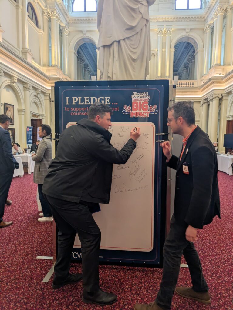 John Lister MP adds his signature to the FCVic pledge board.