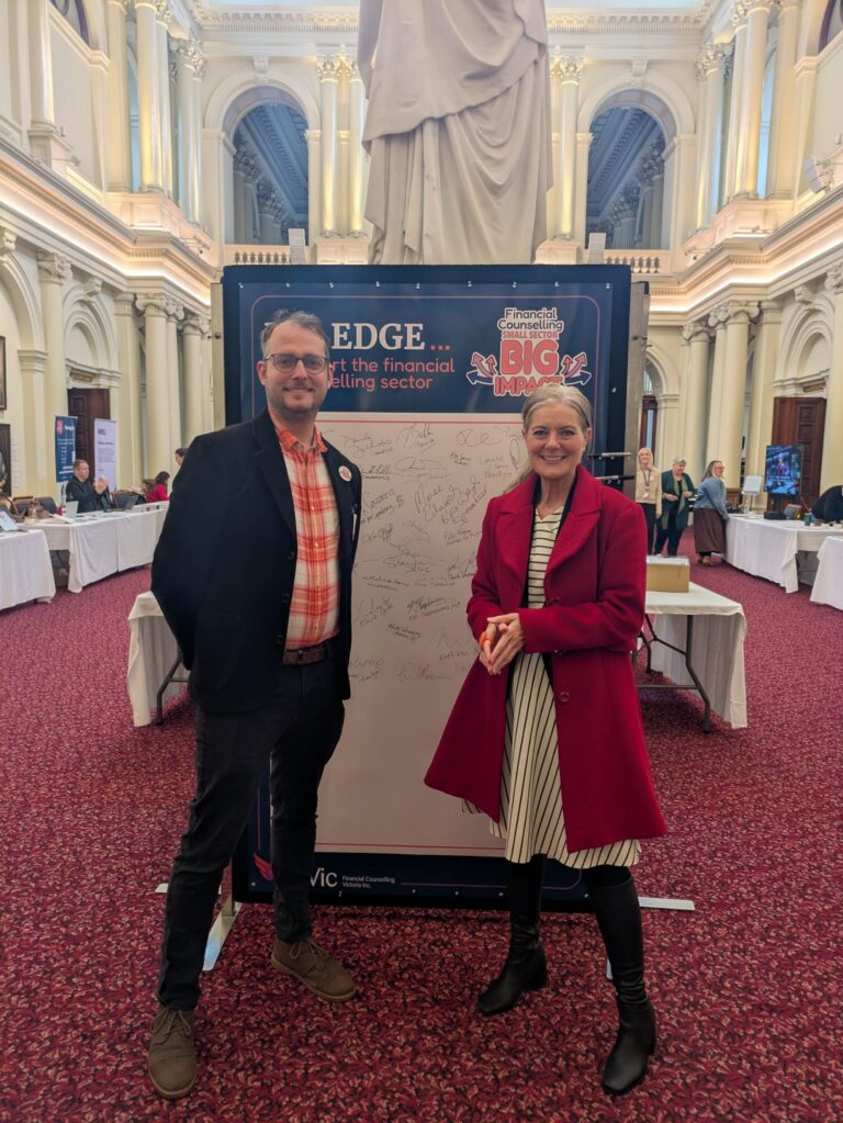 FCVic's CEO stands with The Hon. Sonya Kilkenny, Attorney-General, at the "I Pledge" board in Queen's Hall.
