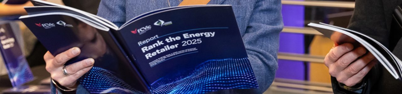 A close up photograph of an attendee leafing through the Rank the Energy Retailer 2025 report